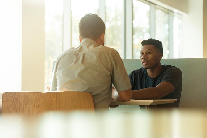 Mentor sharing career advice at a retreat