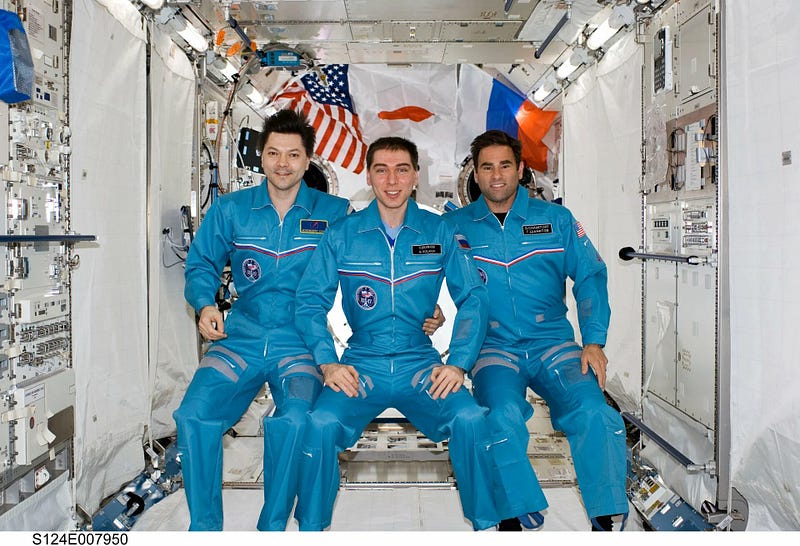 Astronauts communicating from the Kibo module